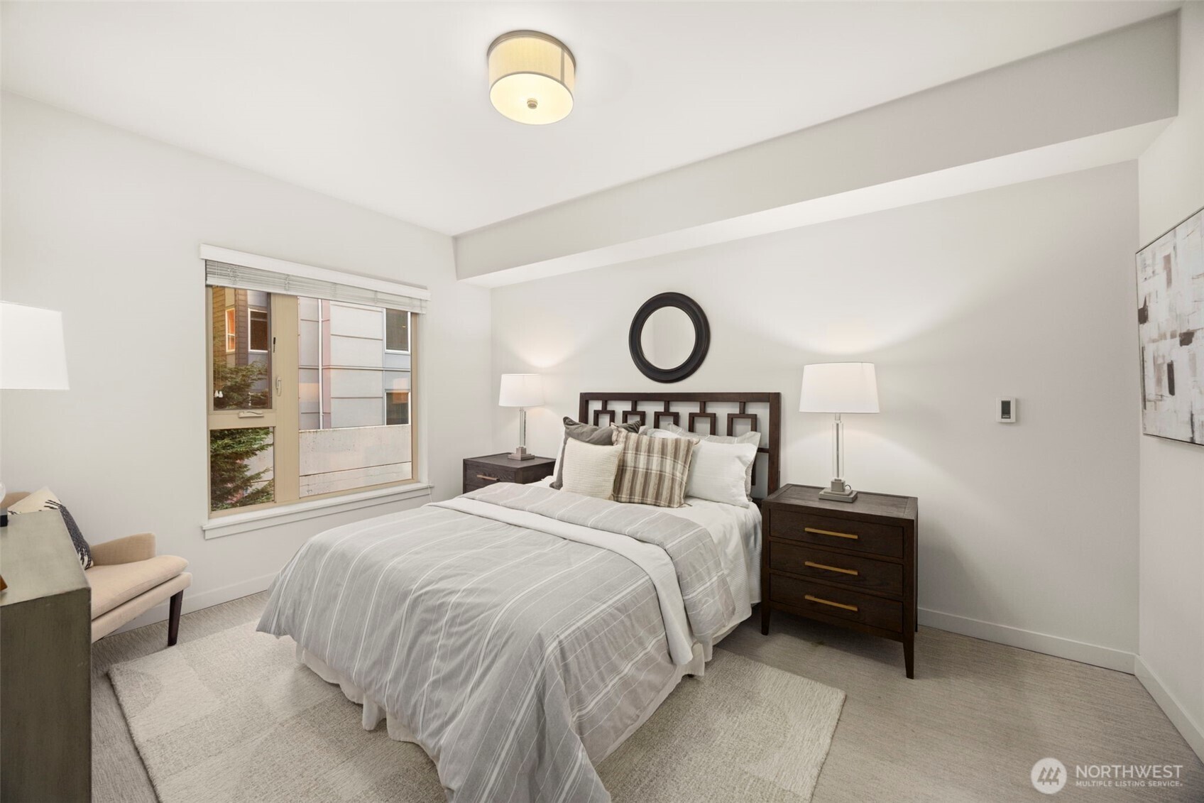 1760 Northwest 56th Street, Unit 309 Seattle, WA 98107 - Photo 16 of 30 a bedroom with a bed and a closet