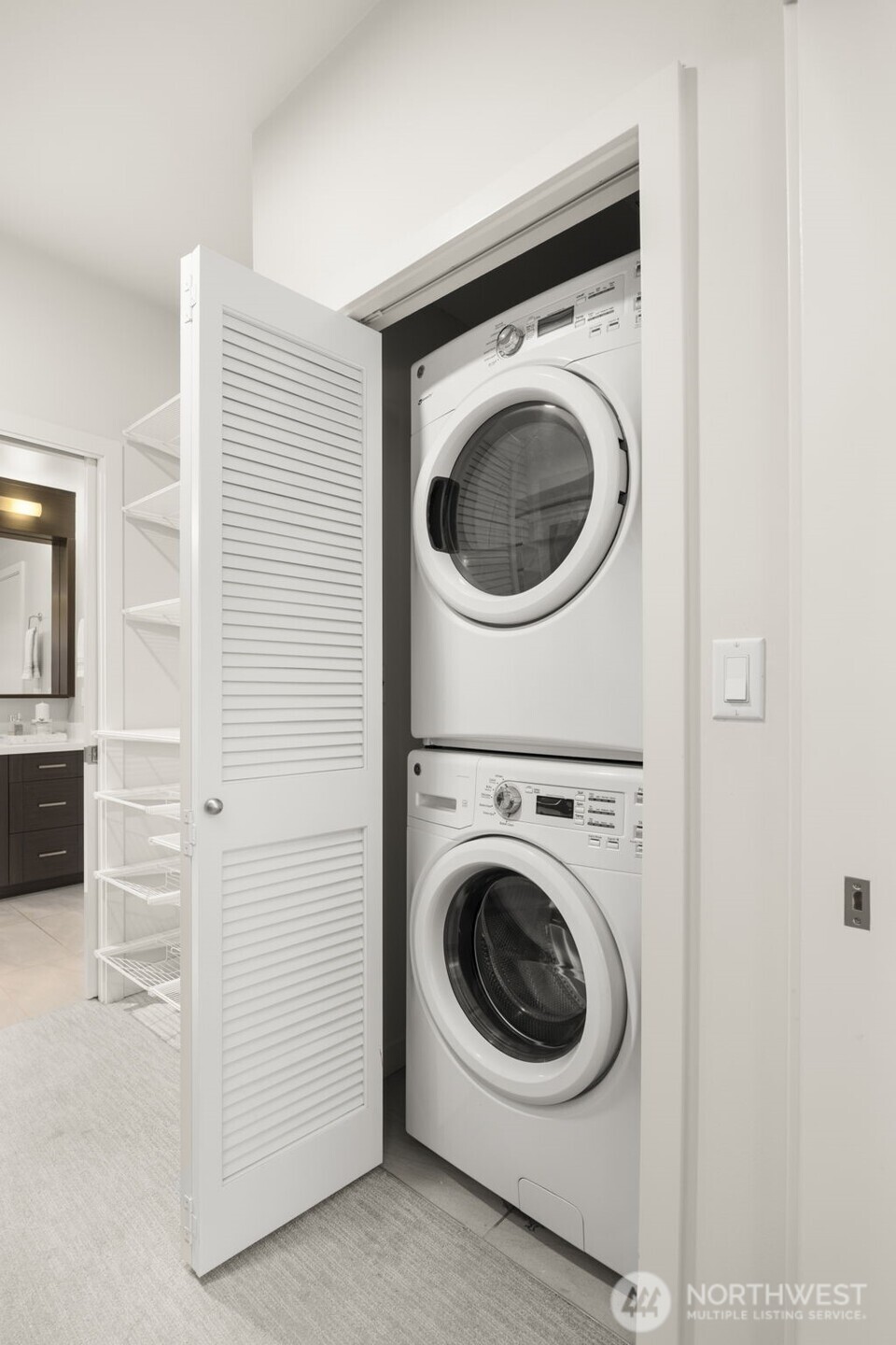 1760 Northwest 56th Street, Unit 309 Seattle, WA 98107 - Photo 21 of 30 a utility room with dryer and washer