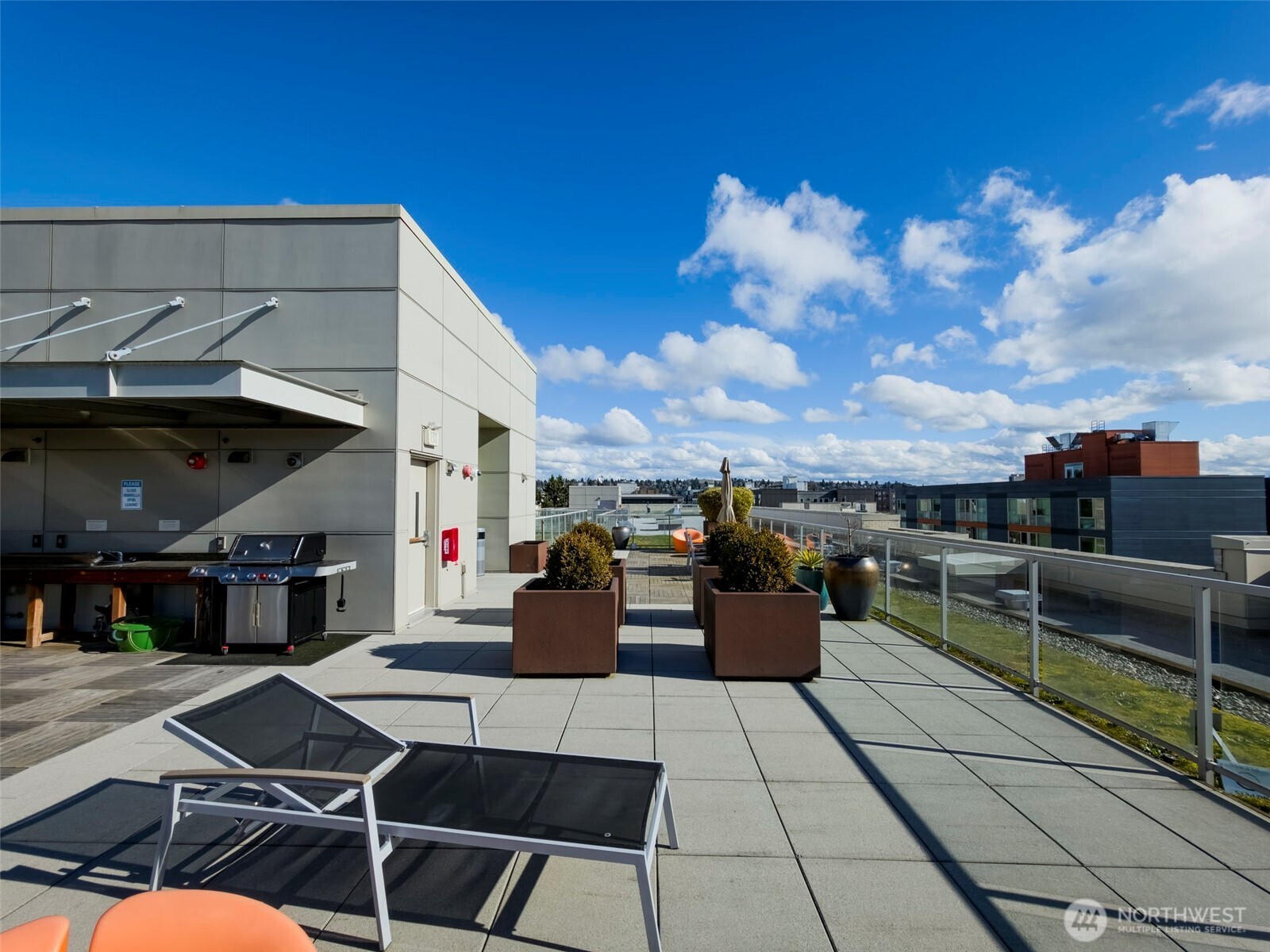 1760 Northwest 56th Street, Unit 309 Seattle, WA 98107 - Photo 27 of 30 a view of a terrace with furniture