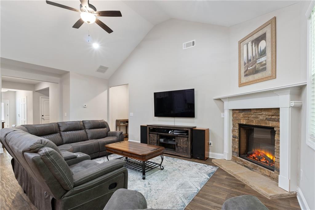 245 Hospital Road Commerce, GA 30529 - Photo 16 of 33 a living room with furniture a flat screen tv and a fireplace