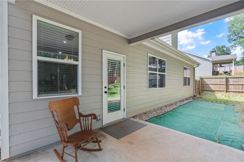 245 Hospital Road Commerce, GA 30529 - Photo 21 of 33 a view of backyard with seating space and deck