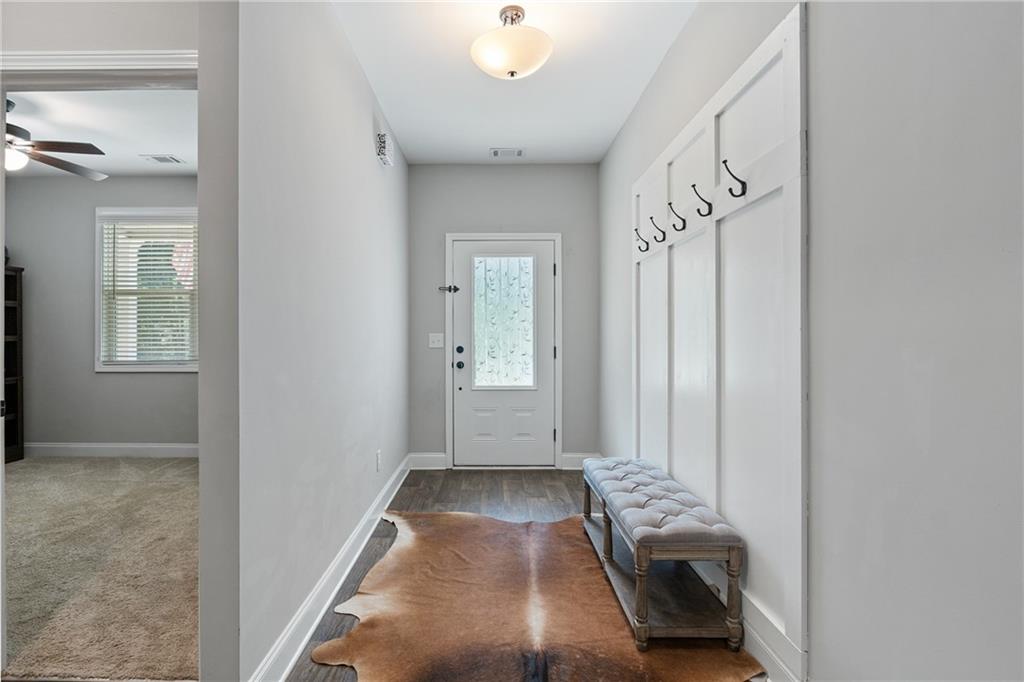 245 Hospital Road Commerce, GA 30529 - Photo 5 of 33 a view of a livingroom with furniture and windows