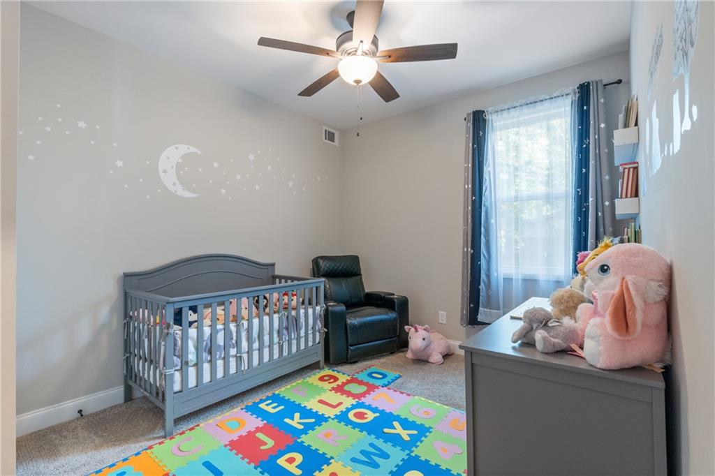 245 Hospital Road Commerce, GA 30529 - Photo 6 of 33 a bedroom with a bed and a window