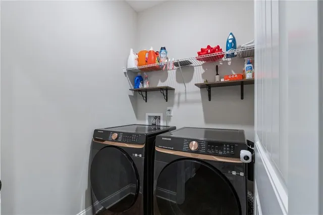 a utility room with dryer and washer