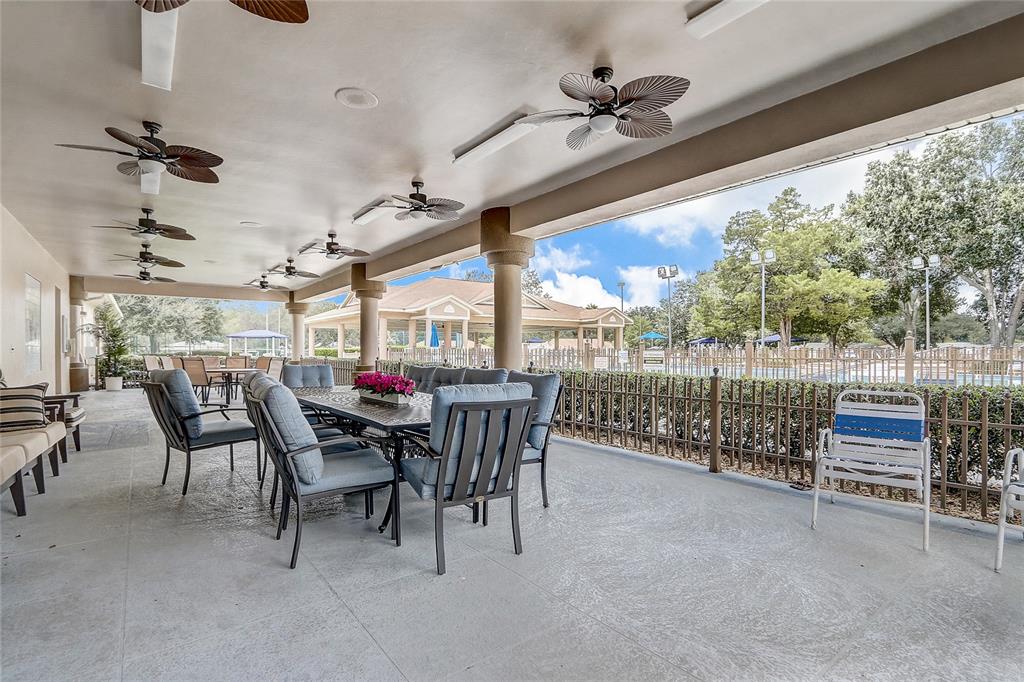 10031 Southwest 62nd Circle Ocala, FL 34476 - Photo 21 of 25 a view of a porch with furniture and a yard
