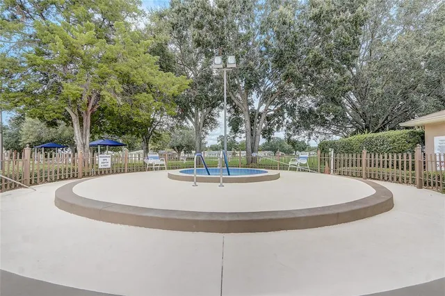 a view of a playground with basketball court
