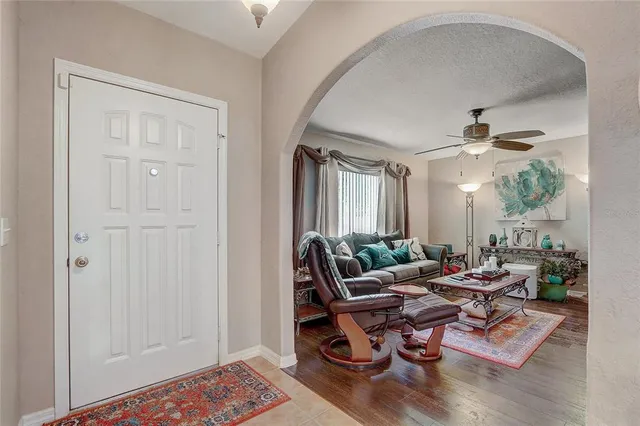 a living room with furniture and a window
