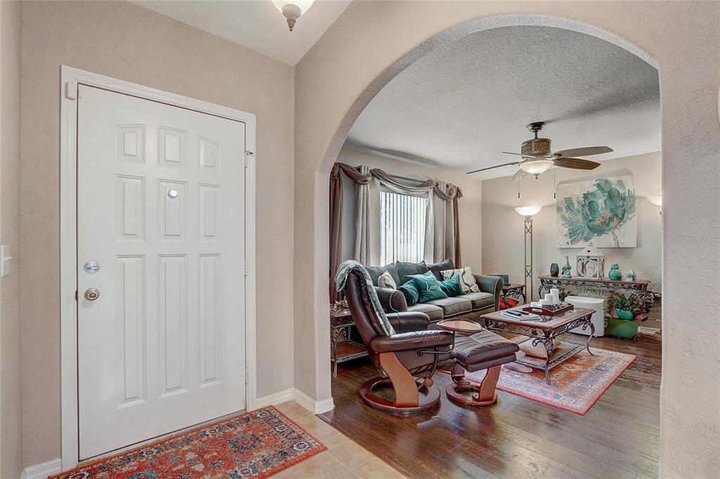 10031 Southwest 62nd Circle Ocala, FL 34476 - Photo 3 of 25 a living room with furniture and a window