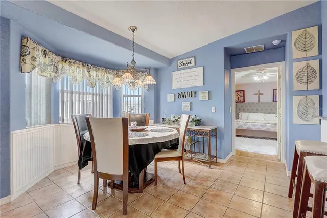 a view of a dining room with furniture window and outside view
