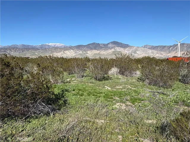 a view of mountain view with mountains in the background