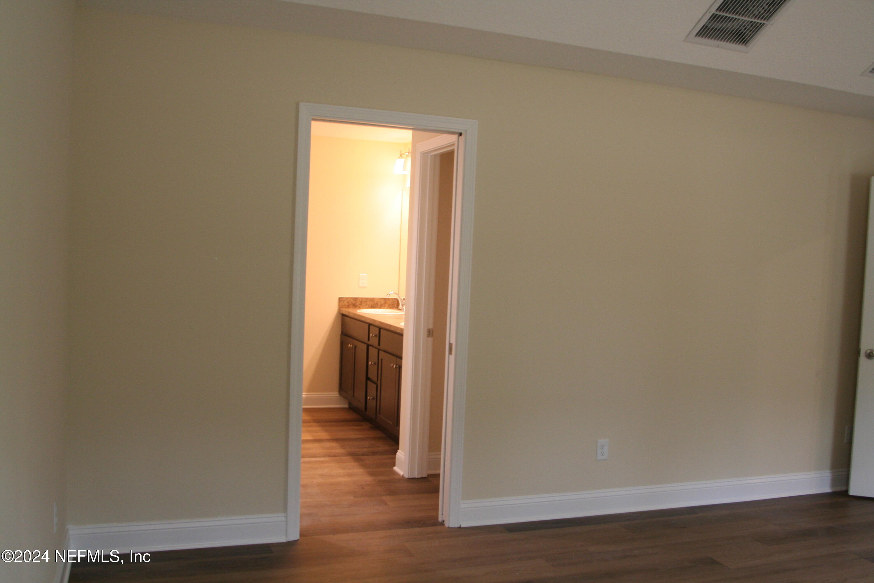 54528 Church Road Callahan, FL 32011 - Photo 24 of 38 a view of a room with wooden floor and closet