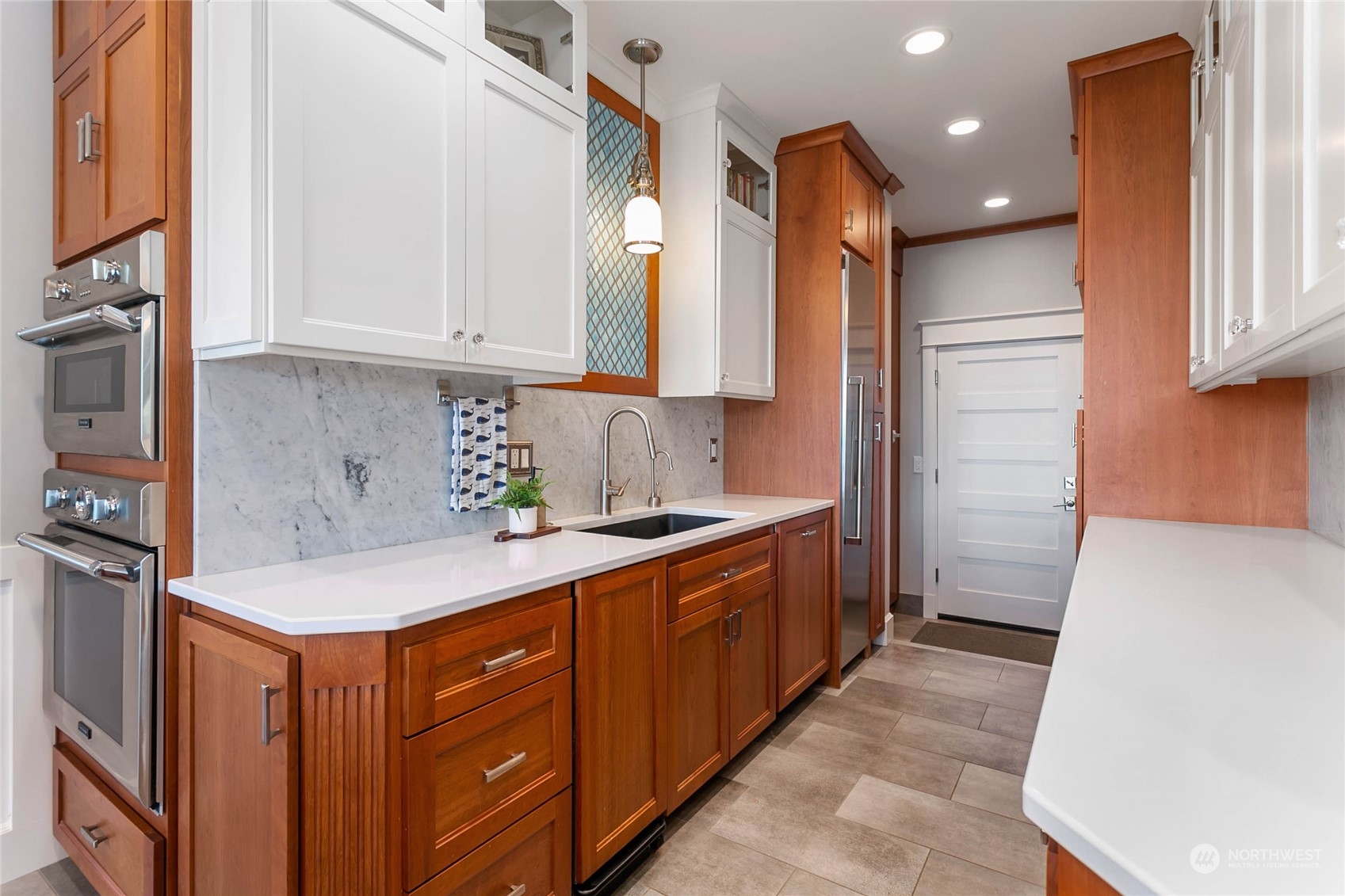 324 Sea Pines Road Bellingham, WA 98229 - Photo 12 of 40 a kitchen with stainless steel appliances granite countertop a sink a stove and a refrigerator