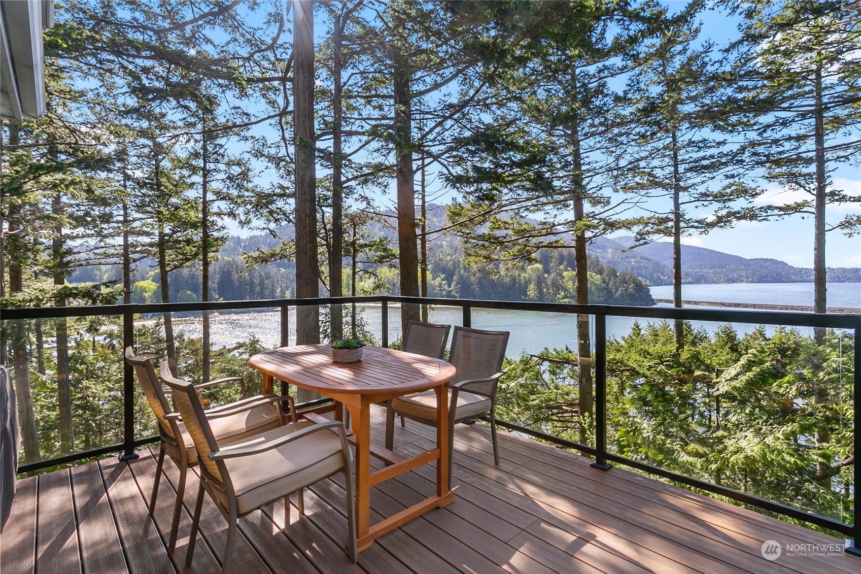 324 Sea Pines Road Bellingham, WA 98229 - Photo 17 of 40 a view of a chairs and table on the wooden deck