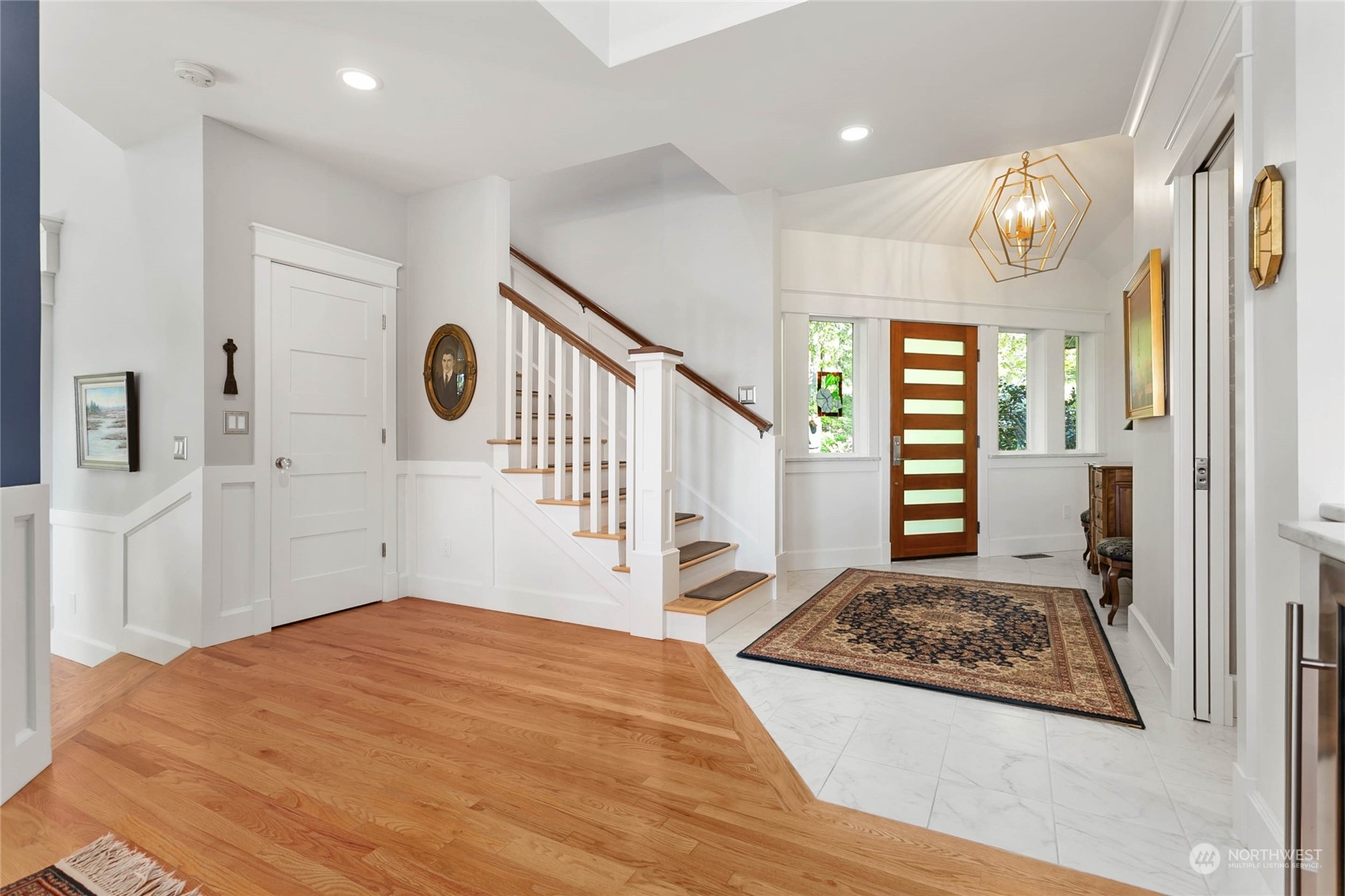 324 Sea Pines Road Bellingham, WA 98229 - Photo 7 of 40 a view of a hallway with wooden floor and door