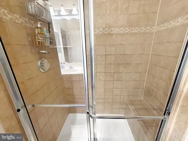 a bathroom with a bathtub a toilet and a shower
