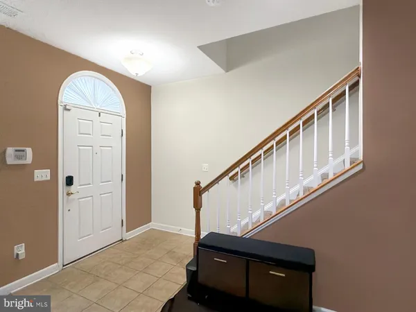 a view of entryway with a front door