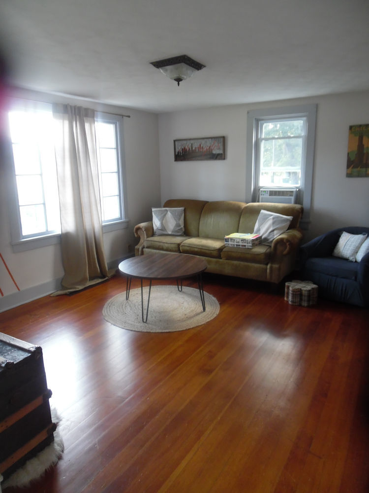 9838 East Flagg Road Rochelle, IL 61068 - Photo 8 of 12 a living room with furniture and a wooden floor