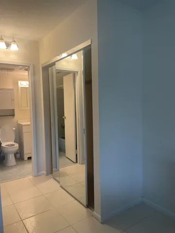 a bathroom with a glass door shower