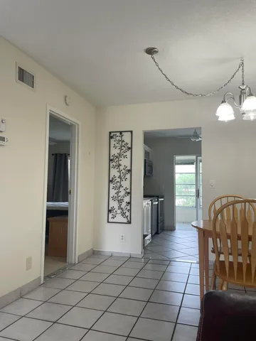 a view of a livingroom with furniture and windows