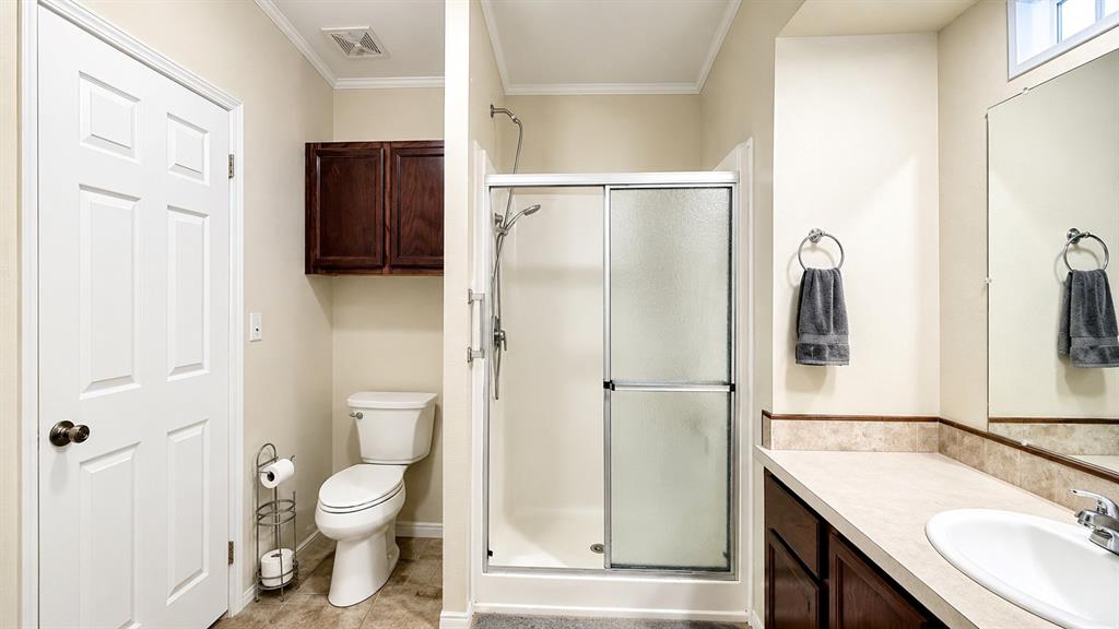 741 Waterfront Row Quitman, TX 75783 - Photo 21 of 40 a bathroom with a granite countertop sink toilet and shower
