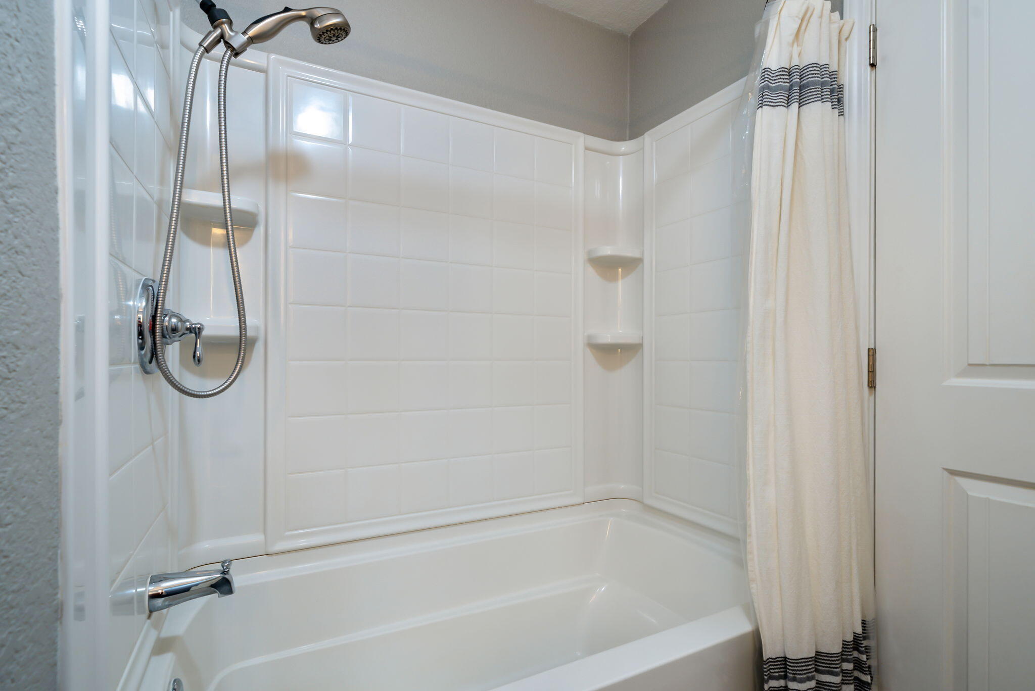 16879 Elsinore Road Bend, OR 97707 - Photo 17 of 48 a bathroom with a shower and a bath tub