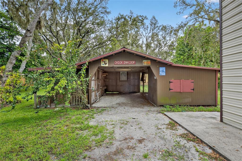 11205 McMullen Road Riverview, FL 33569 - Photo 17 of 46 a front view of a house with a yard and garage