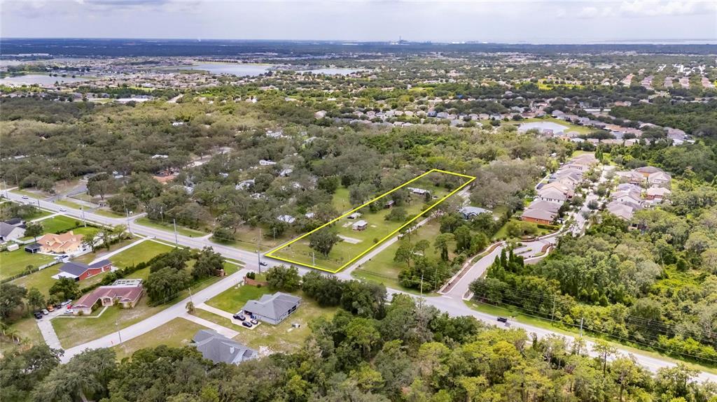 11205 McMullen Road Riverview, FL 33569 - Photo 24 of 46 an aerial view of residential house with an outdoor space and seating