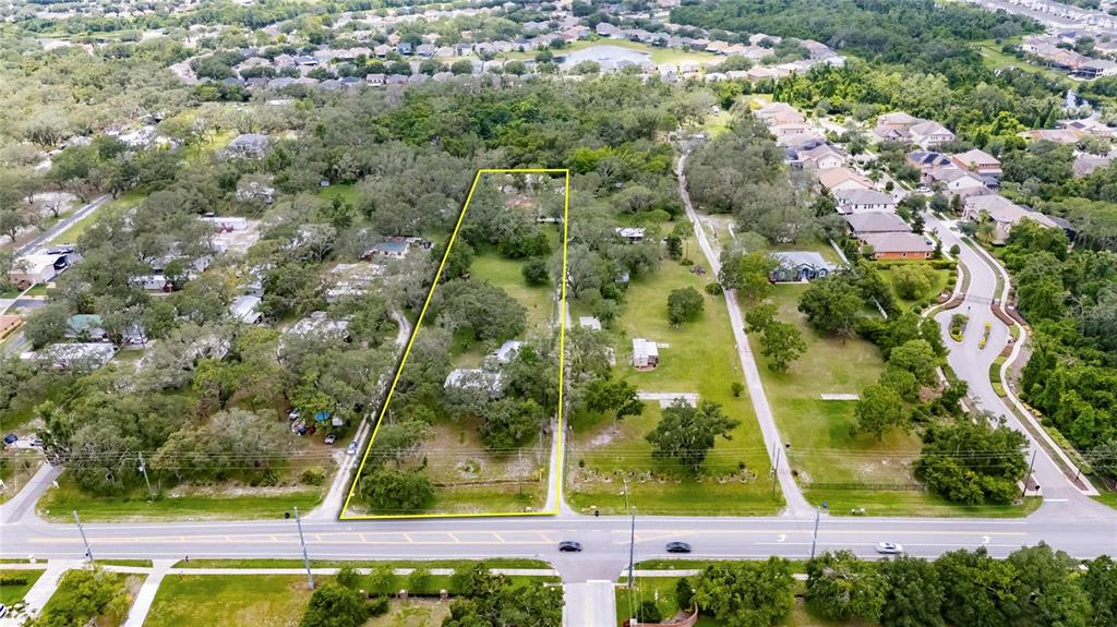 11205 McMullen Road Riverview, FL 33569 - Photo 26 of 46 an aerial view of a residential houses with yard