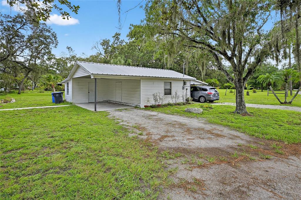11205 McMullen Road Riverview, FL 33569 - Photo 5 of 46 a view of a house with a yard