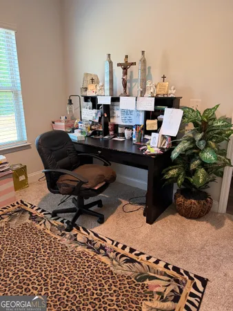 a living room with furniture and a rug