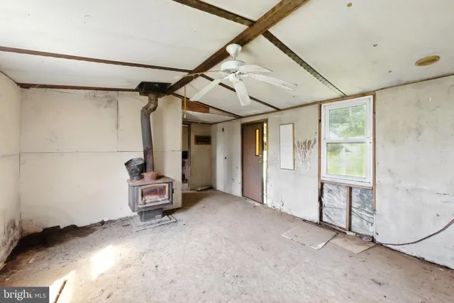a view of a room with rack and wooden floor
