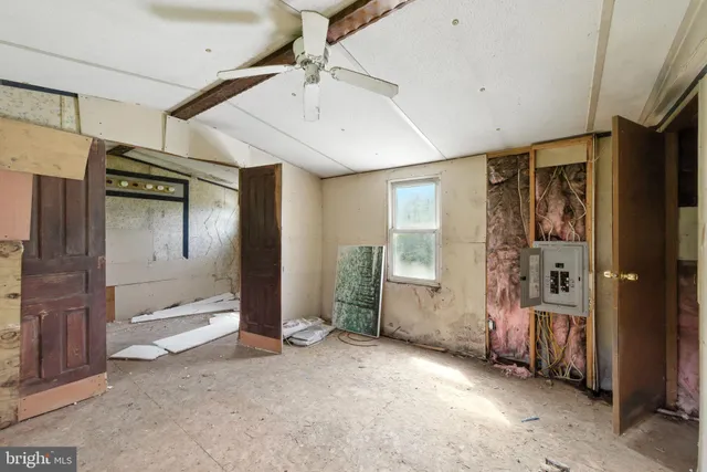 a living room with furniture and a gate