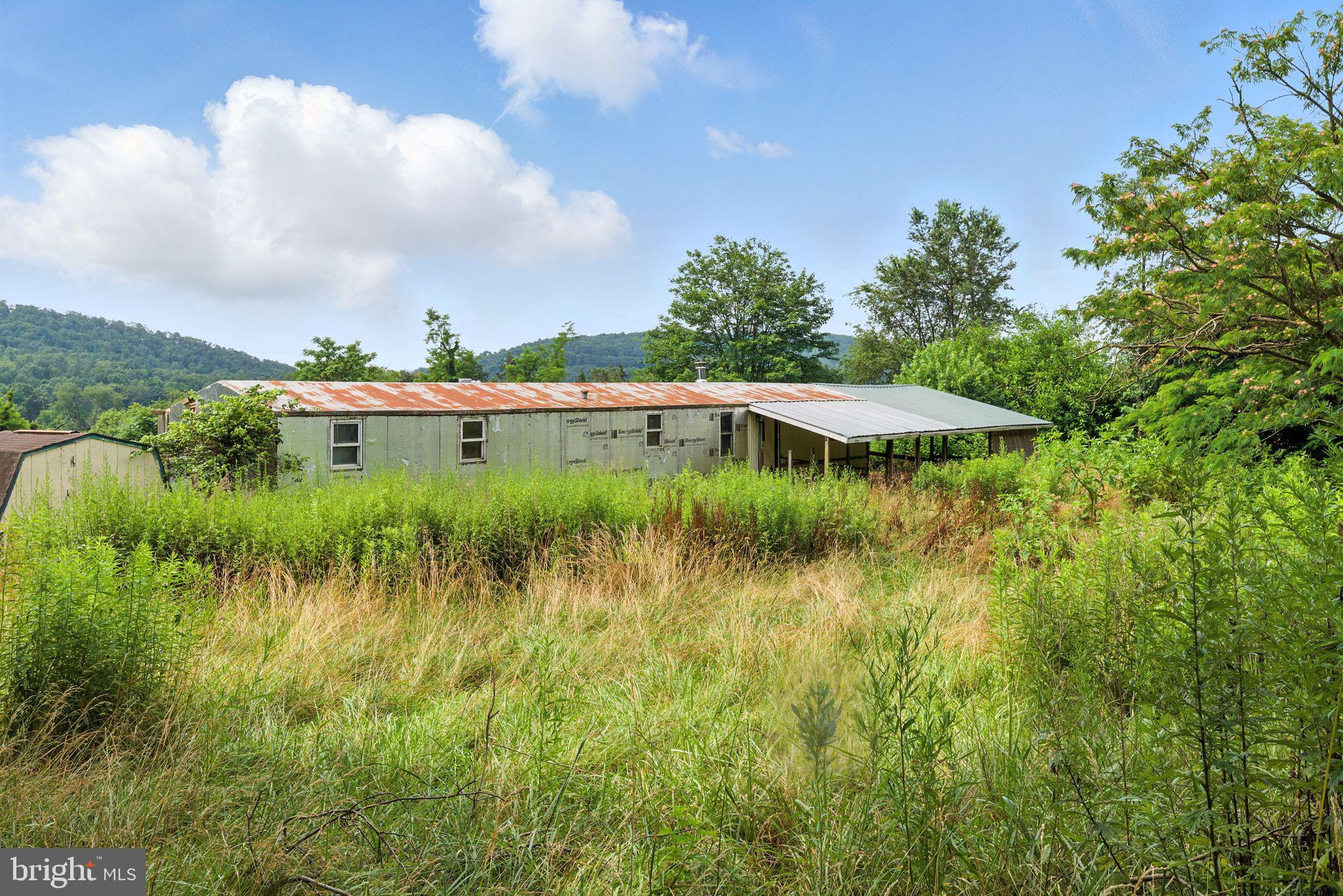 40 Ridge Road New Bloomfield, PA 17068 - Photo 4 of 29 a view of a lake with a big yard