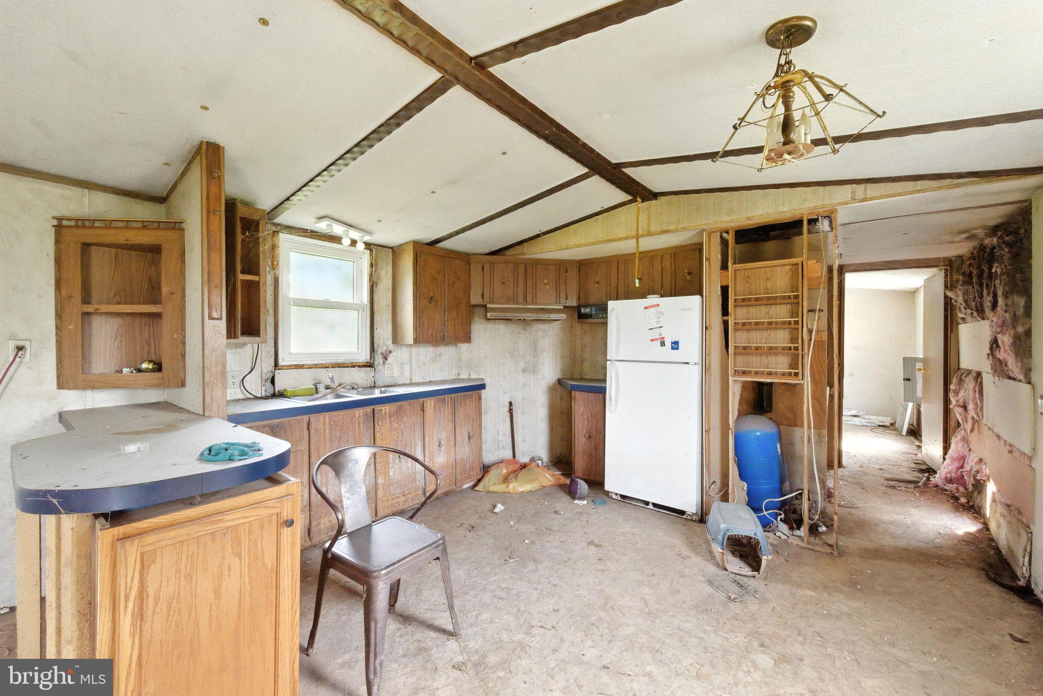 40 Ridge Road New Bloomfield, PA 17068 - Photo 7 of 29 a view of a hallway with furniture and refrigerator