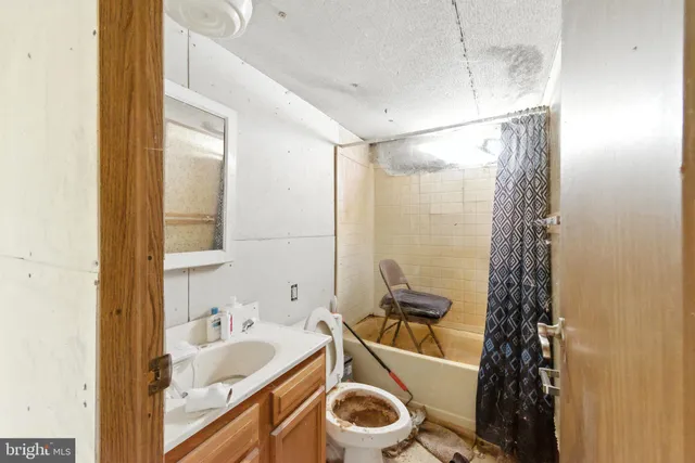 a view of a room with wooden walls