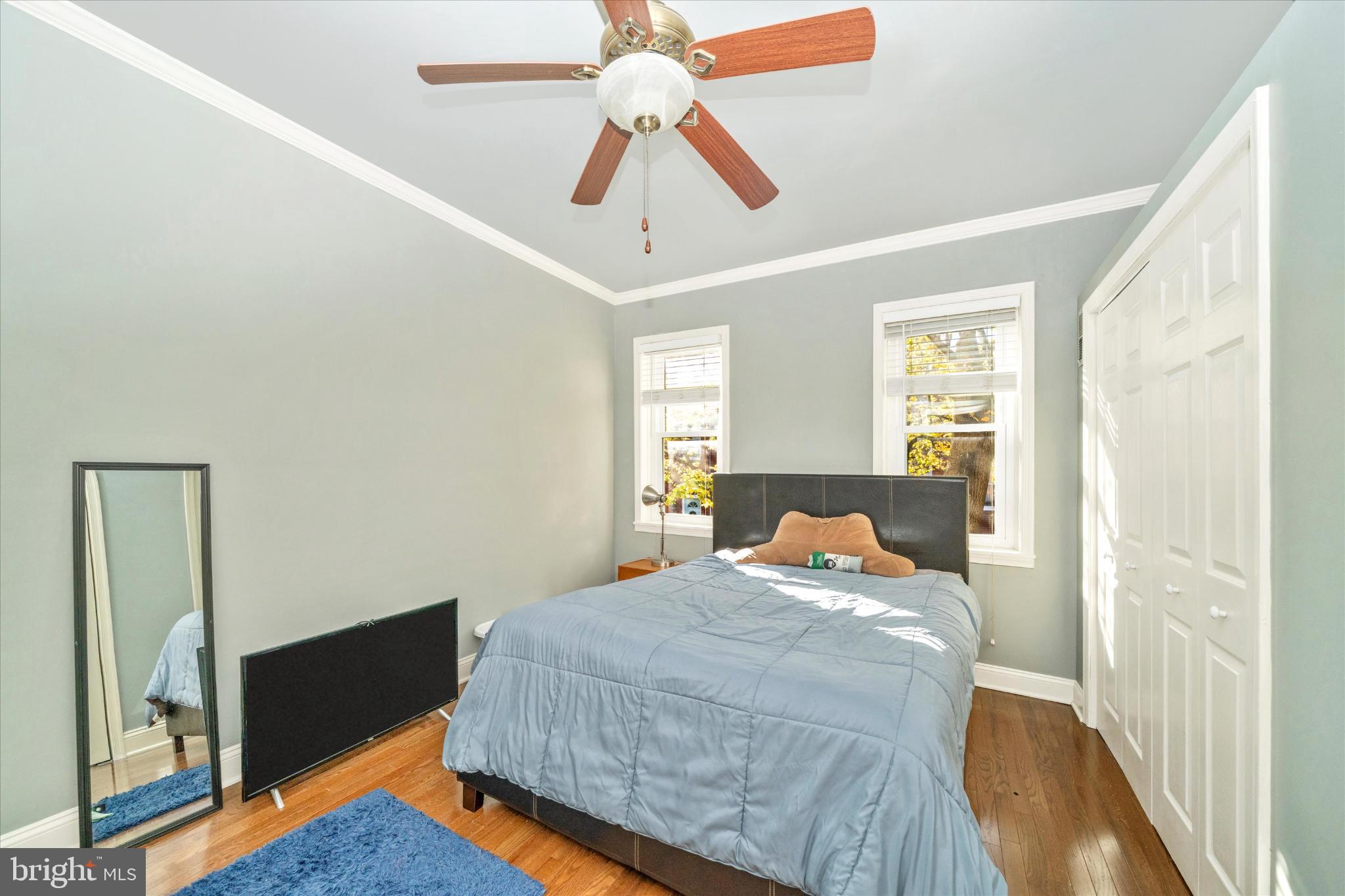 1221 William Street Baltimore, MD 21230 - Photo 18 of 44 a bedroom with a bed and a chandelier