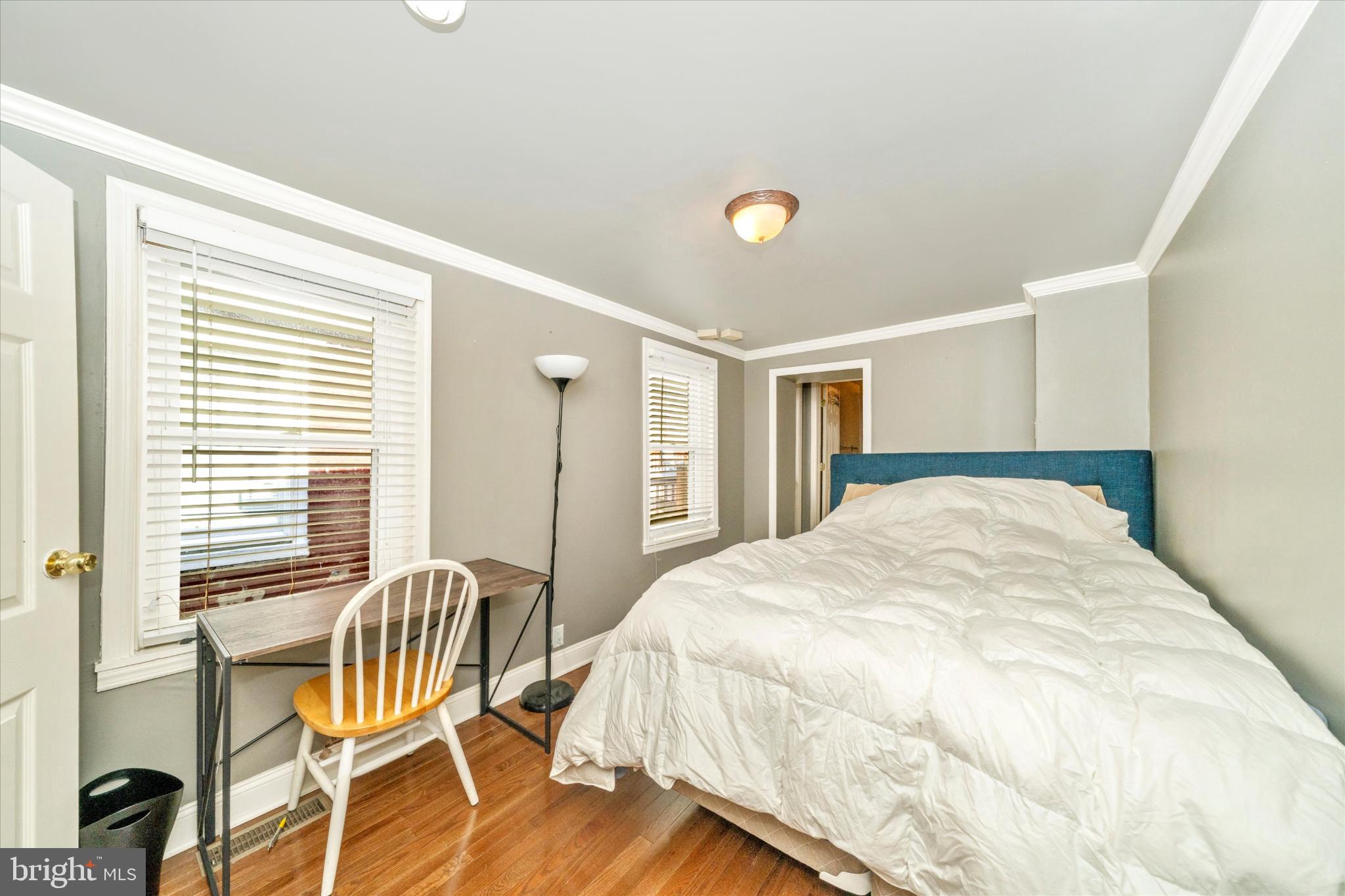1221 William Street Baltimore, MD 21230 - Photo 21 of 44 a spacious bedroom with a bed and a window