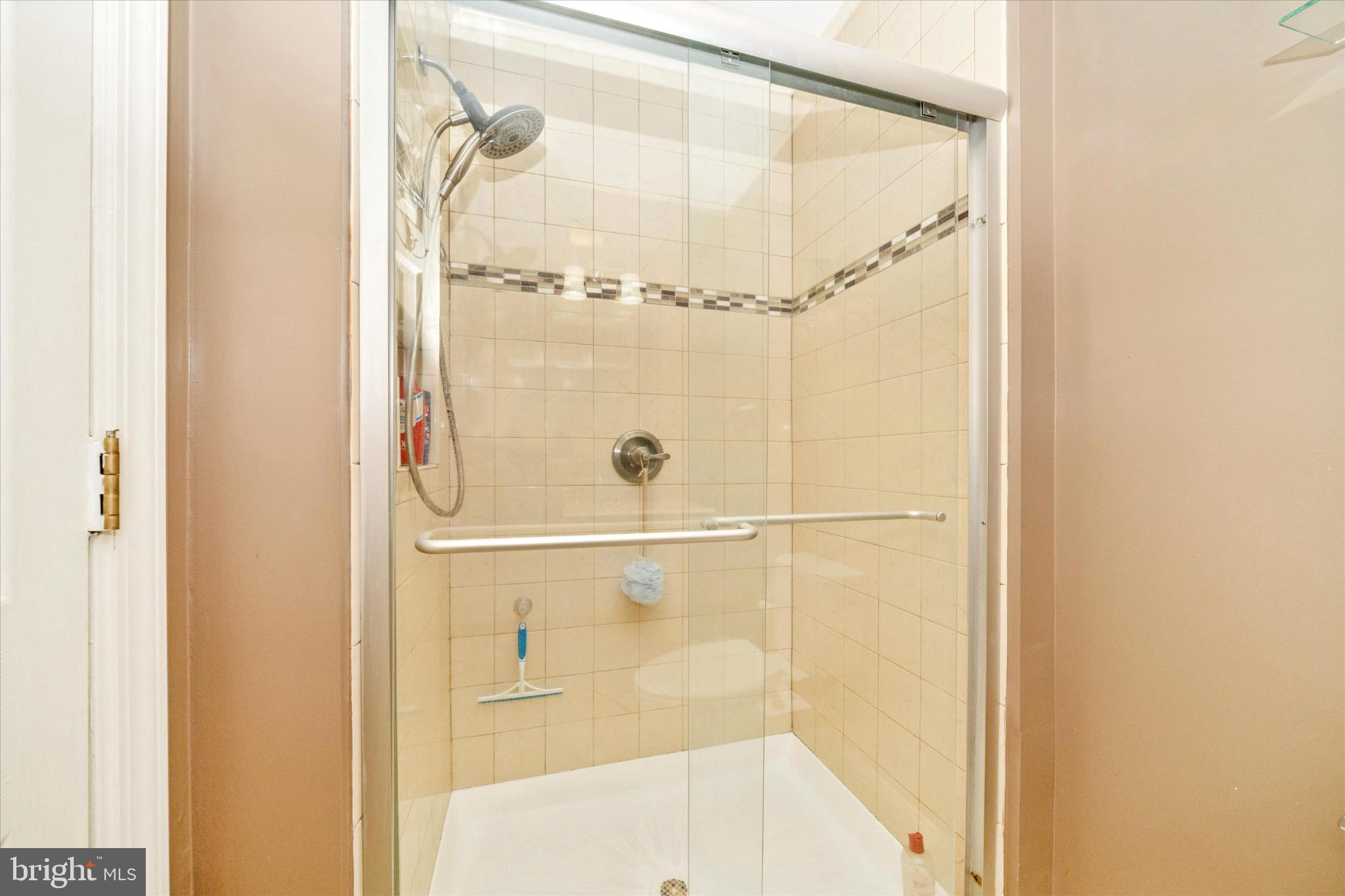 1221 William Street Baltimore, MD 21230 - Photo 28 of 44 a bathroom with a glass shower door