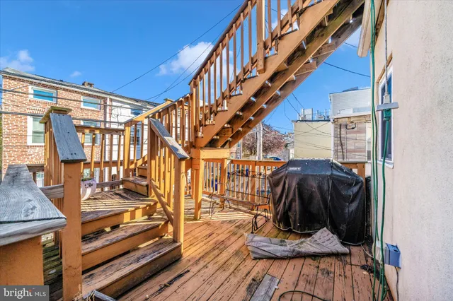 a view of entryway with wooden floor and stairs
