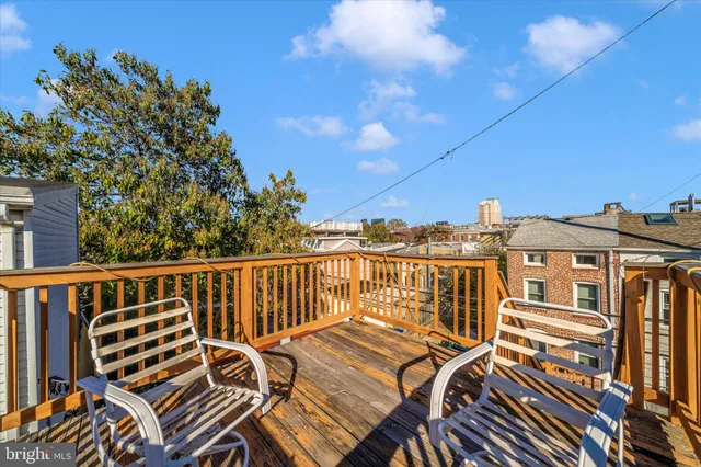 a view of a balcony with chairs