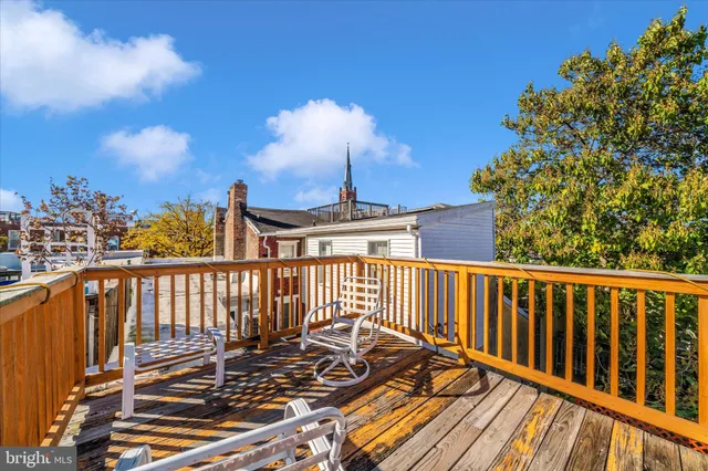 a view of a balcony with wooden floor