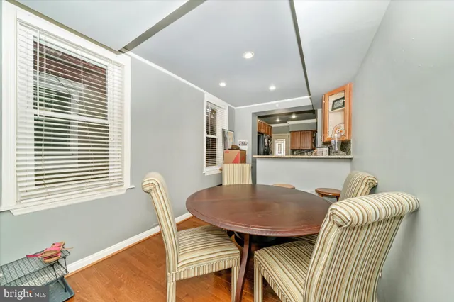 a dining room with furniture and window