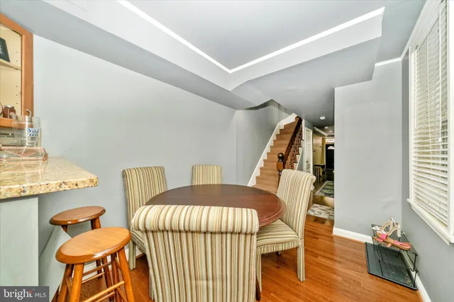 a bedroom with furniture and a wooden floor
