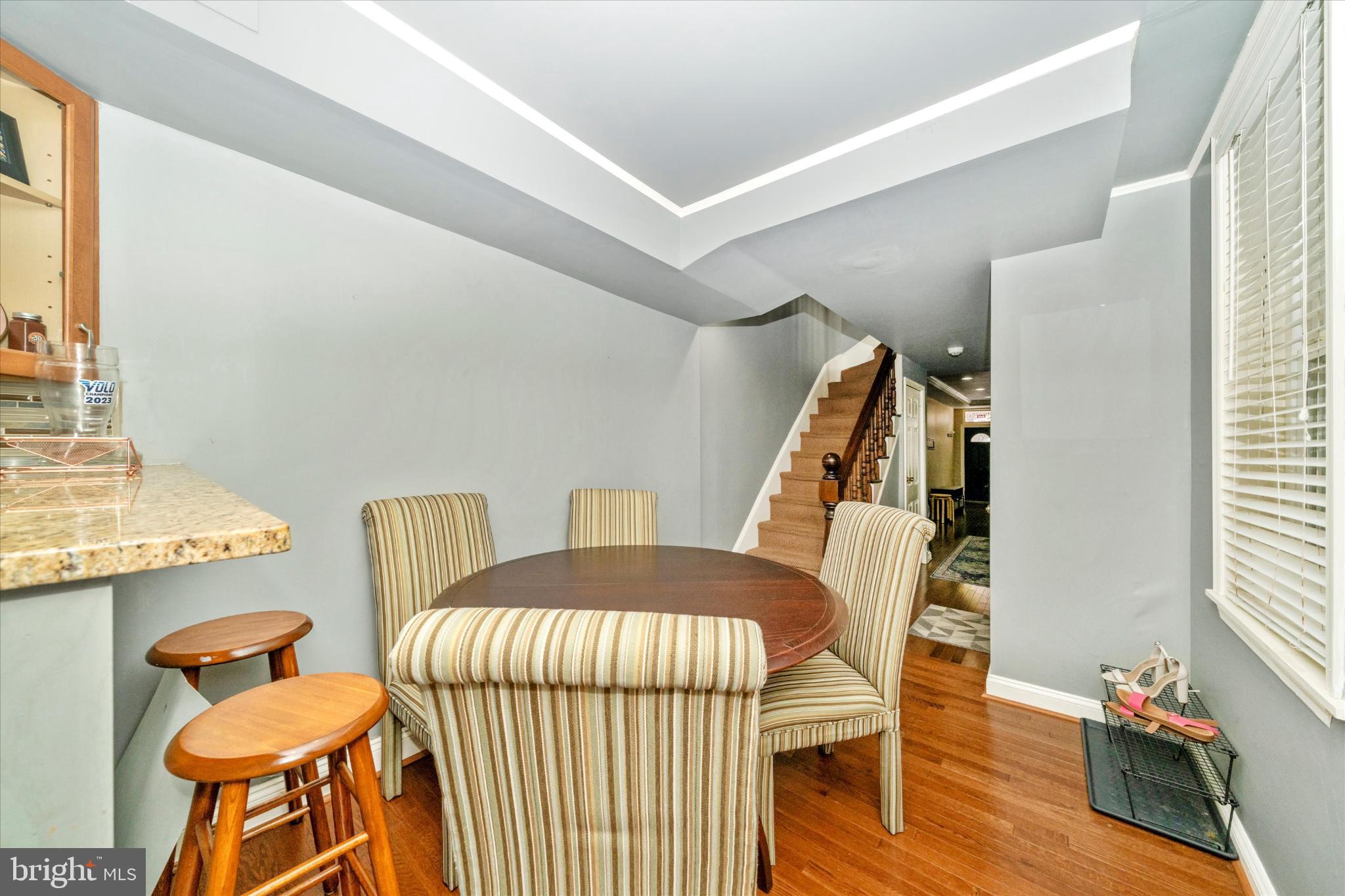 1221 William Street Baltimore, MD 21230 - Photo 10 of 44 a bedroom with furniture and a wooden floor