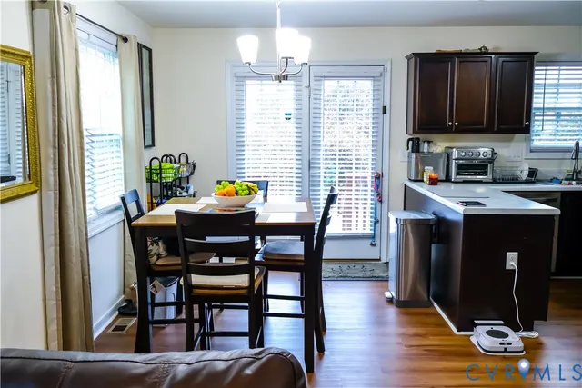 a view of a dining room with furniture and window