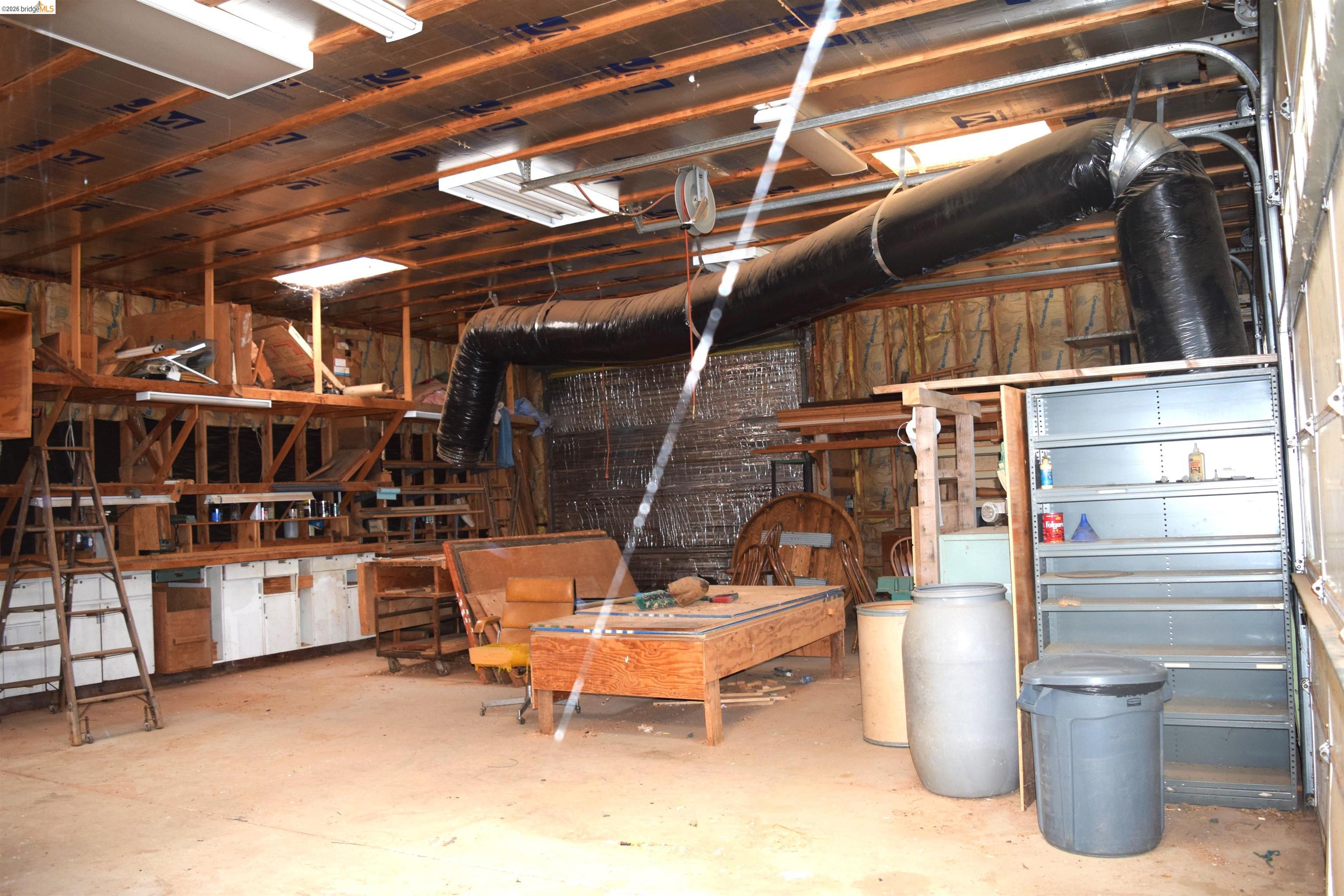 913 Quill Road Copperopolis, CA 95228 - Photo 14 of 55 a view of a storage room with racks