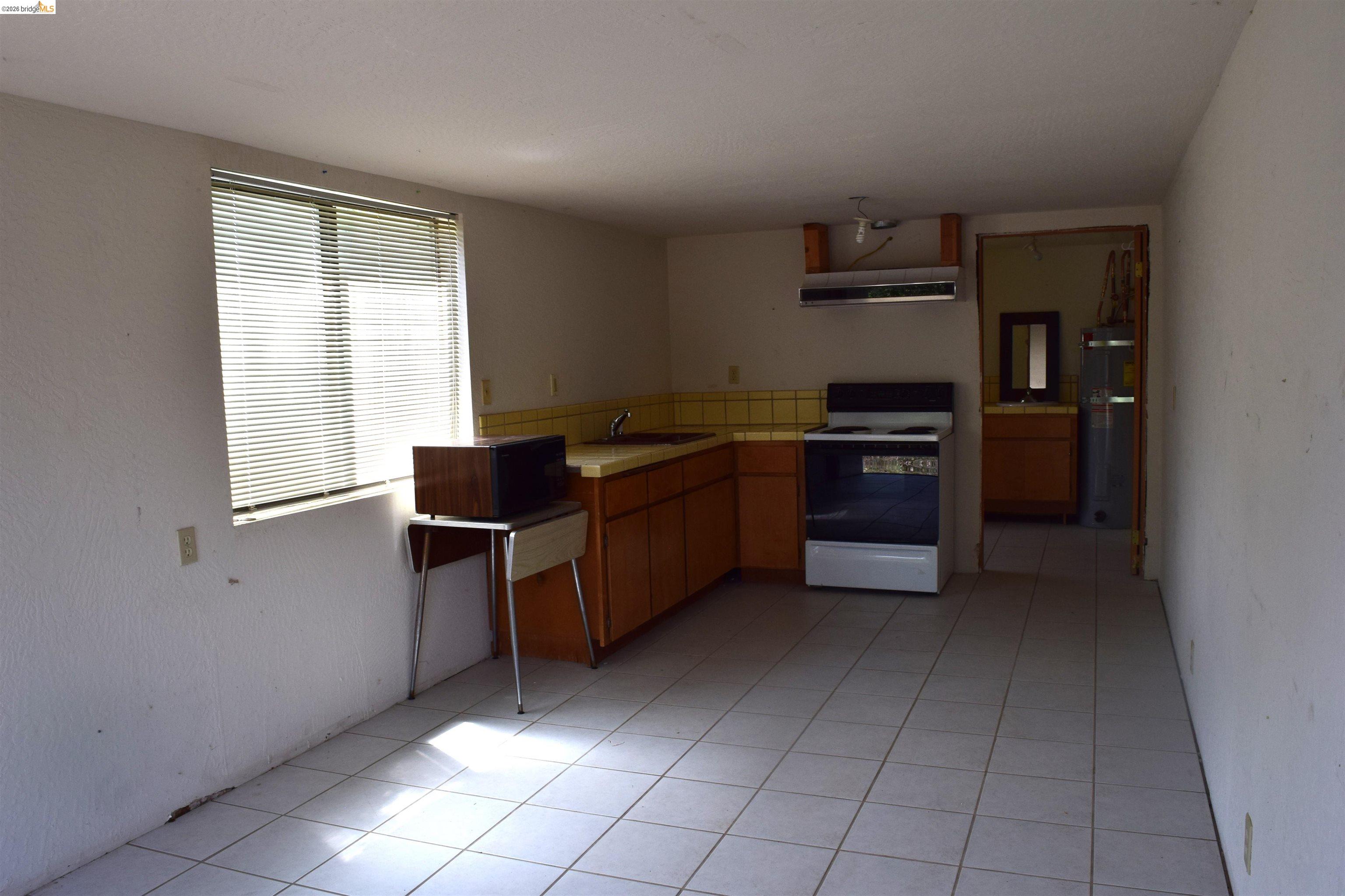 913 Quill Road Copperopolis, CA 95228 - Photo 15 of 55 a kitchen with stainless steel appliances granite countertop a refrigerator and a stove
