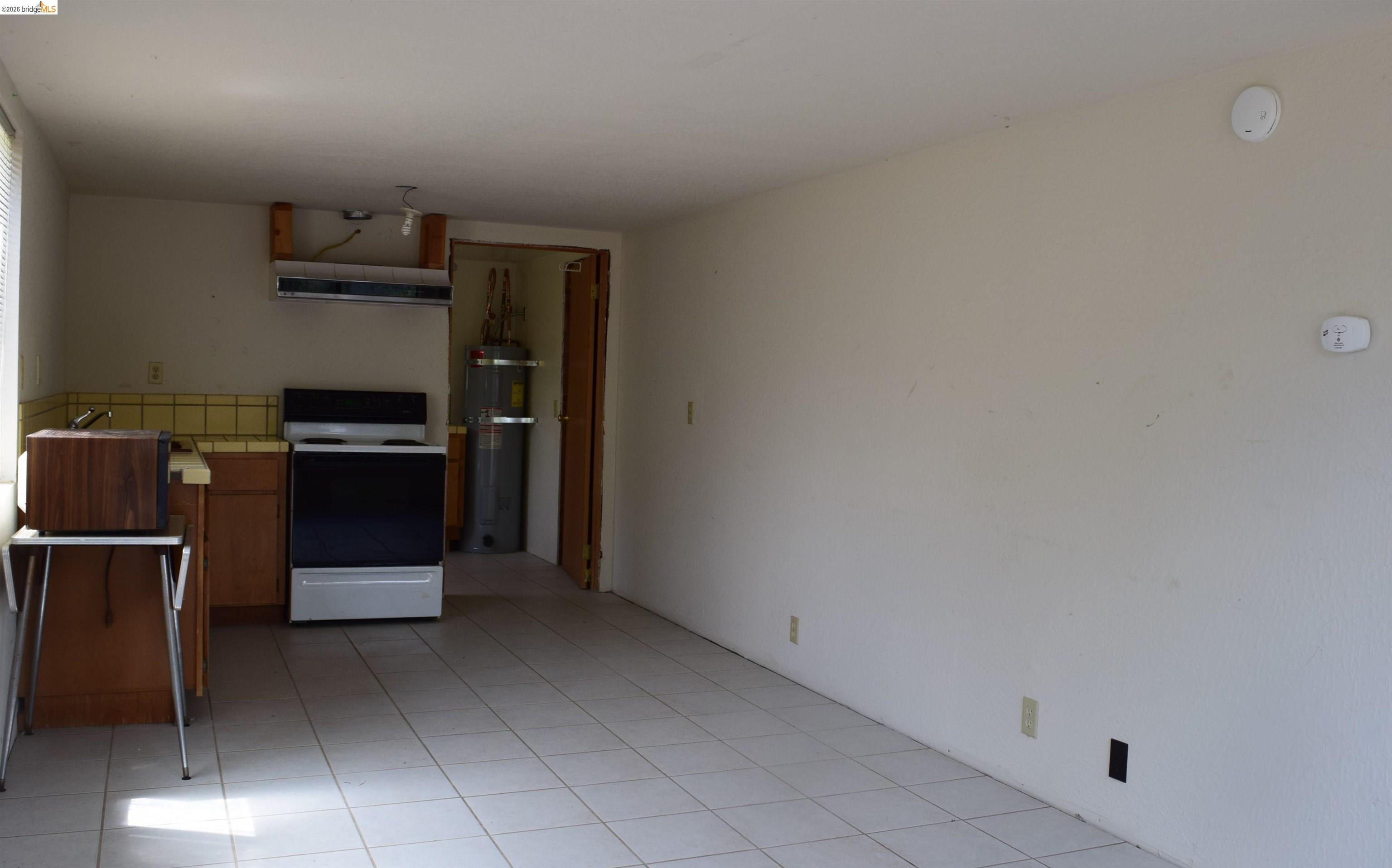 913 Quill Road Copperopolis, CA 95228 - Photo 17 of 55 a view of an empty room with a kitchen
