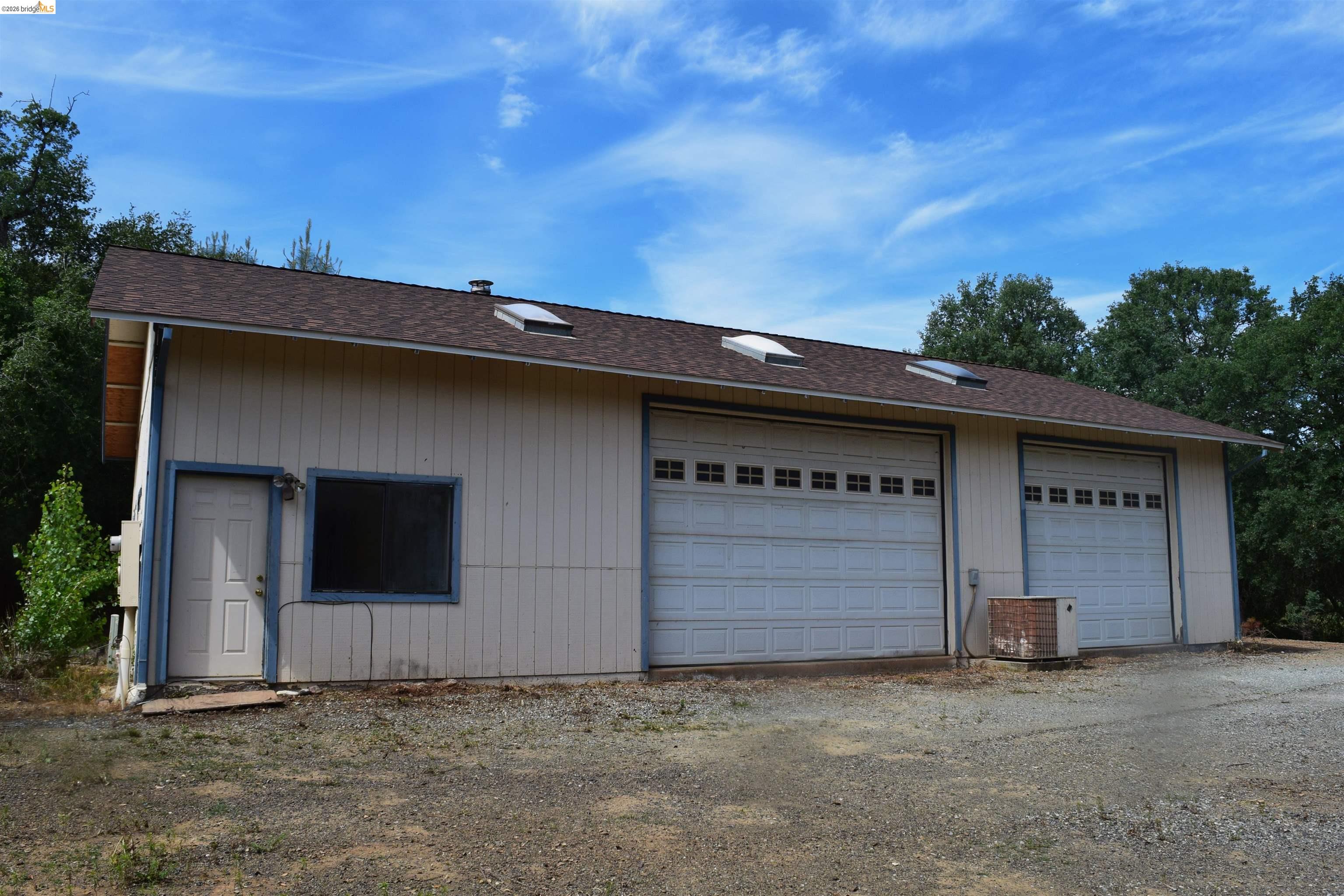 913 Quill Road Copperopolis, CA 95228 - Photo 3 of 55 a front view of a house with a garage