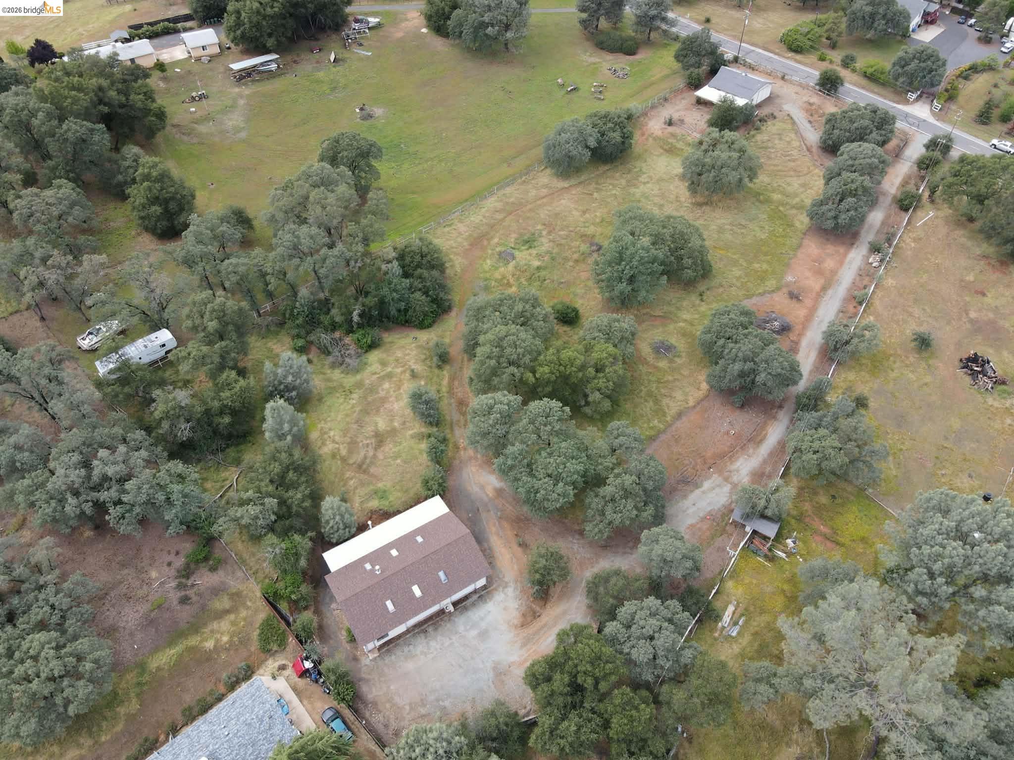 913 Quill Road Copperopolis, CA 95228 - Photo 55 of 55 Expansive property featuring a brown-roofed building, mature trees, and open land